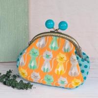 【Angela】さん / あめ玉がま口ポーチ(ネコ・オレンジ)